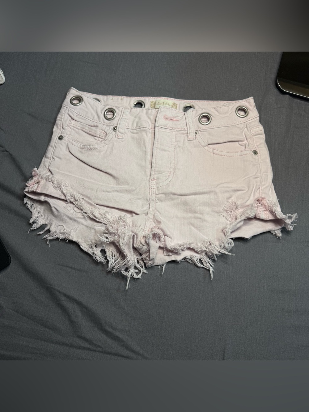 Altar'd State Pale Pink Distressed Denim Shorts with Grommet Waist